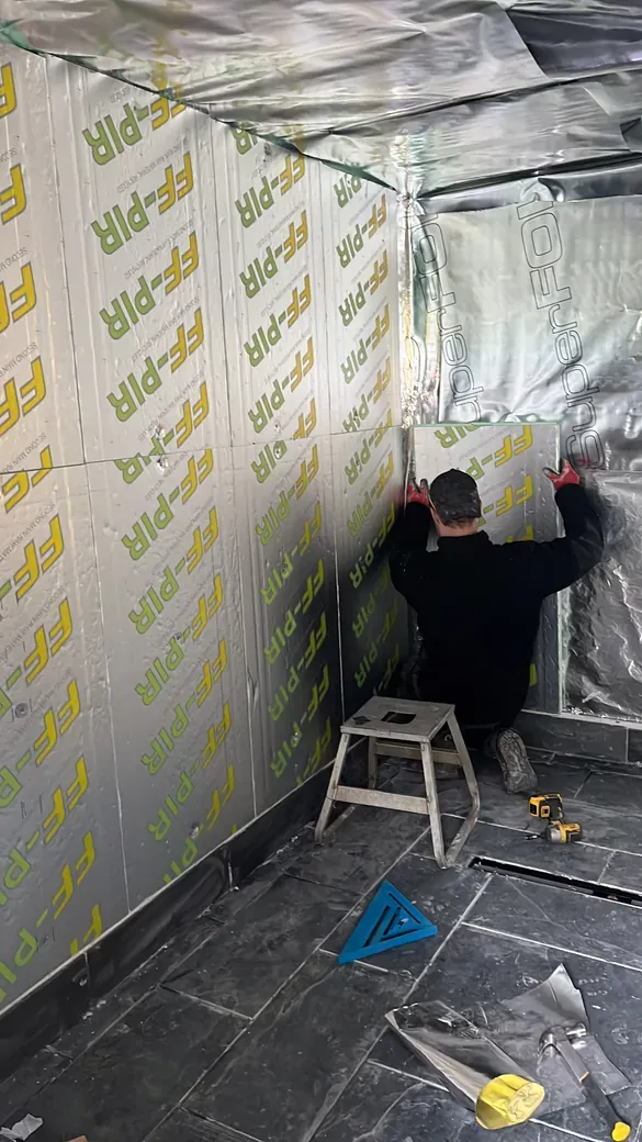 Vapour barrier up, followed by the second layer of insulation