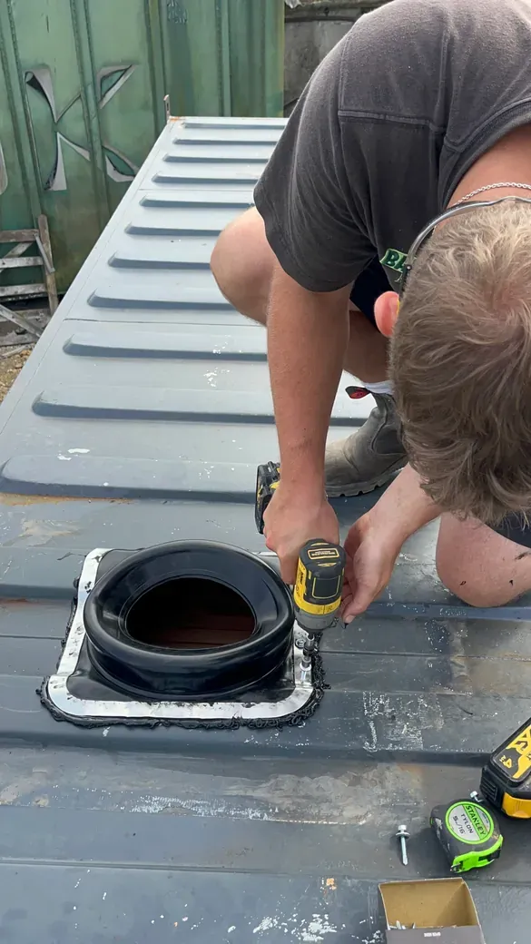 Flange going in, after a whole tube of high-heat sealant
