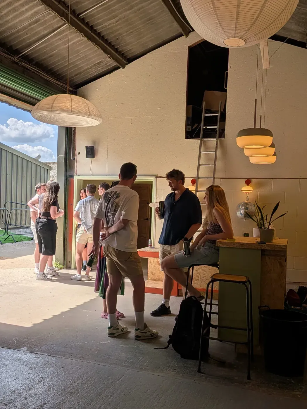 A team gathered in the bar and indoor space at Balta Chill before getting changed